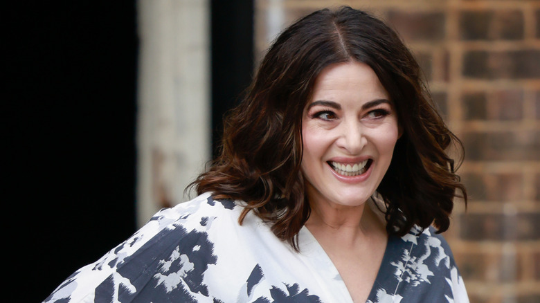 Nigella Lawson smiles as she poses at Australian Fashion Week