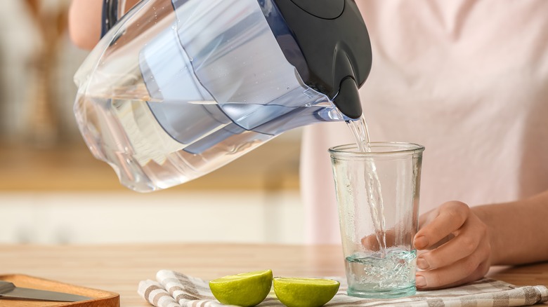 Pouring filtered water from pitcher