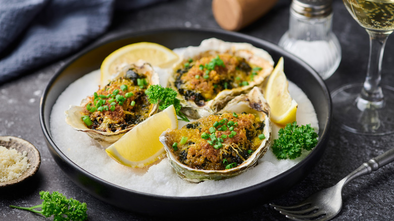 Plate of Oysters Rockefeller served on a bed of salt