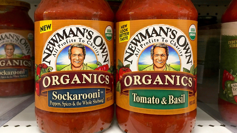 Newman's Own organic pasta sauce on a shelf.