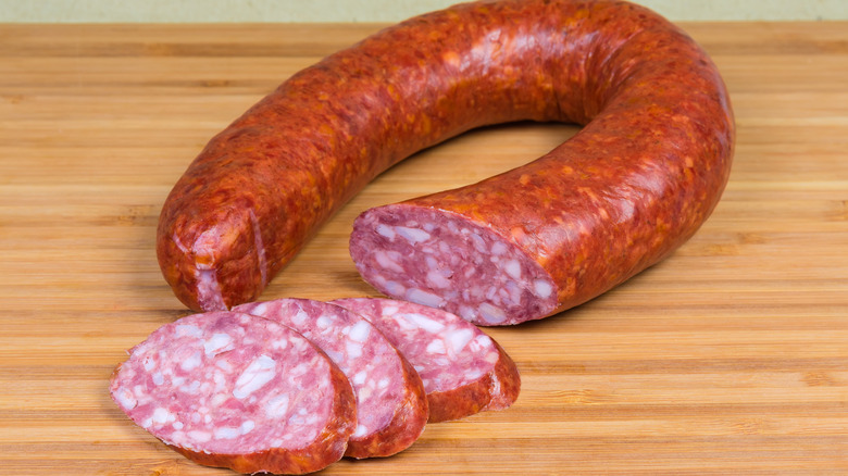 Sliced ring bologna on a wooden table