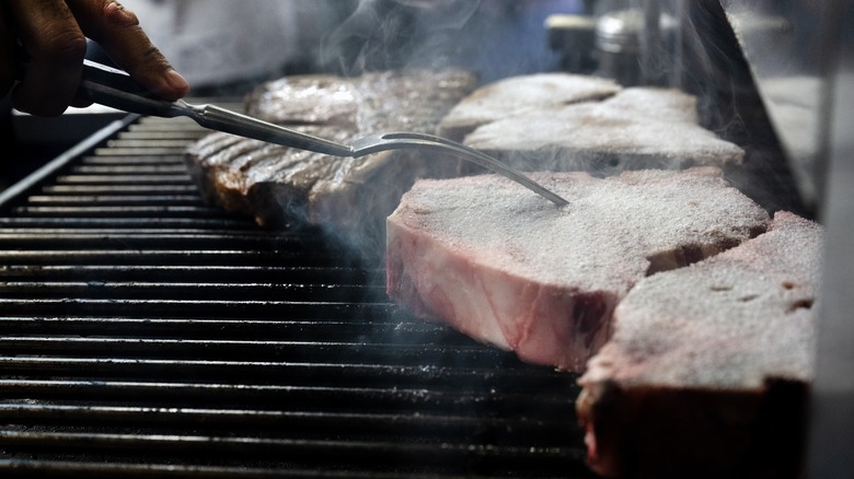 Steaks cooking on broiler 
