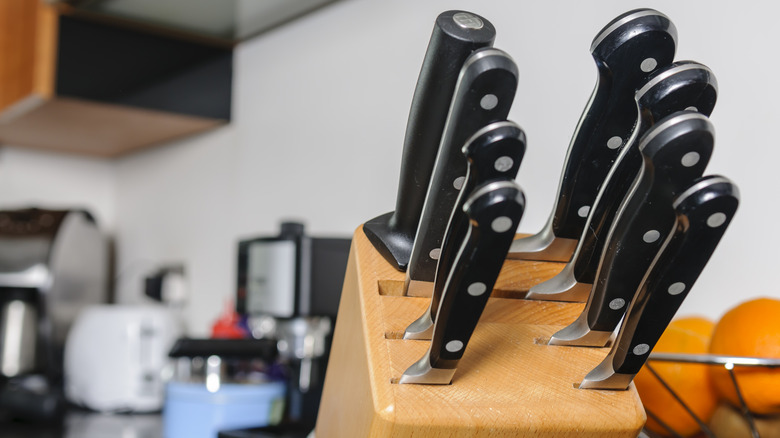 Knives stored sideways in block