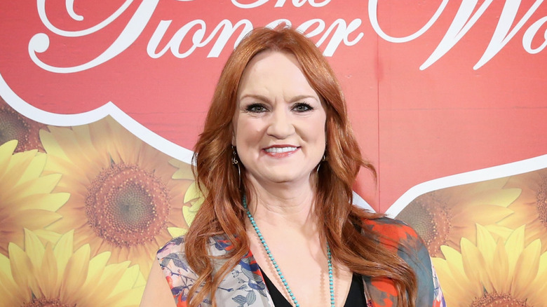 Ree Drummond at a Pioneer Woman event in front of a floral background