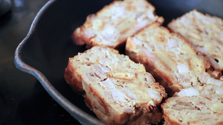 scrapple slices in frying pan