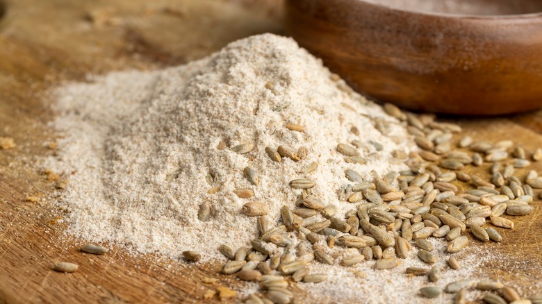 spelt flour next to spelt grains