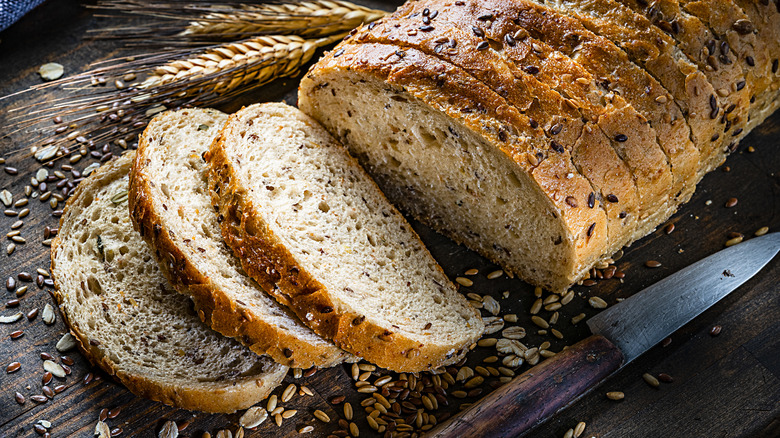 wheat bread loaf partially sliced