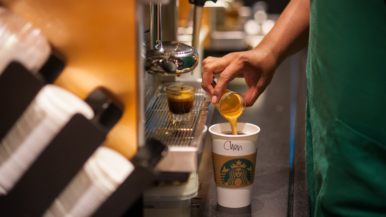 Starbucks employee making coffee