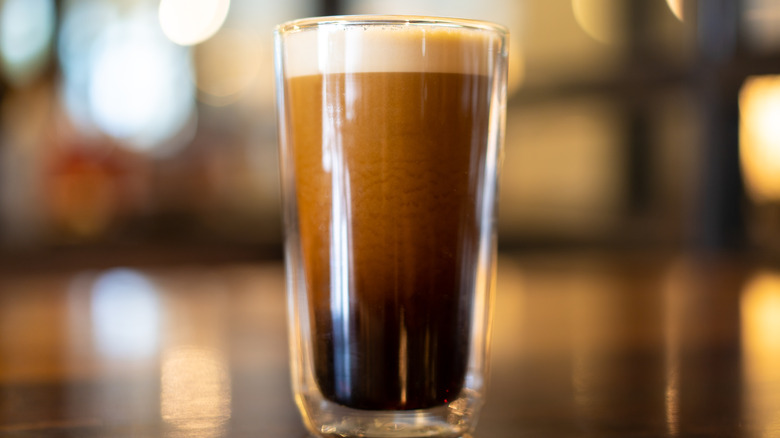 Glass of foamy nitro cold brew