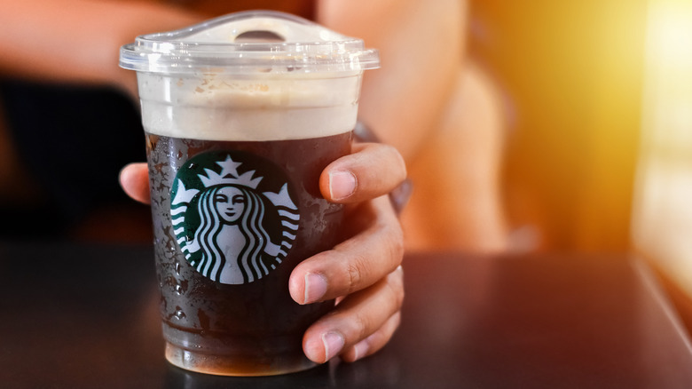 hand holding starbucks nitro cold brew