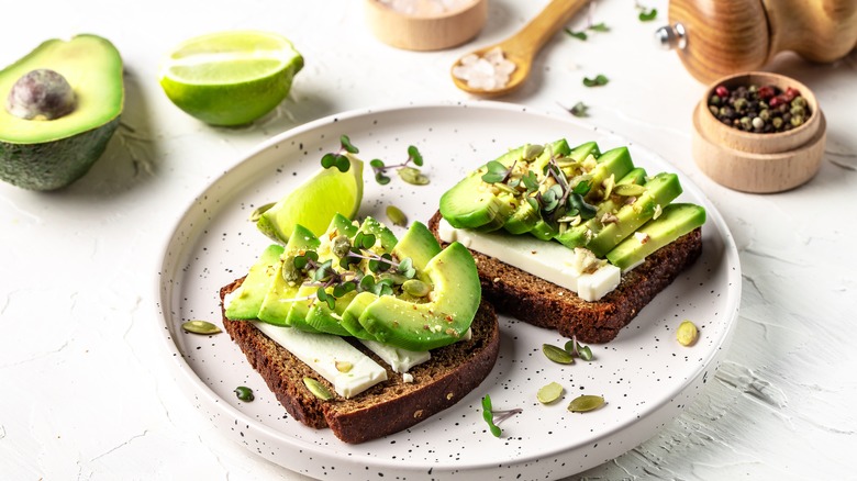 Avocado toast on white plate