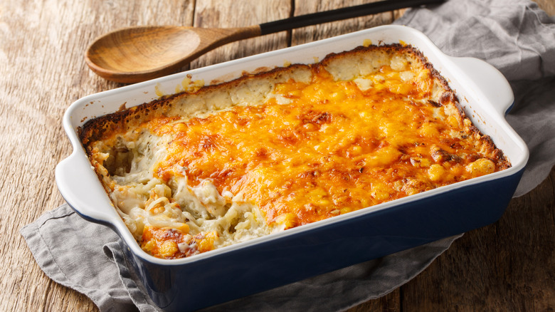 a creamy hashbrown casserole covered with cheese