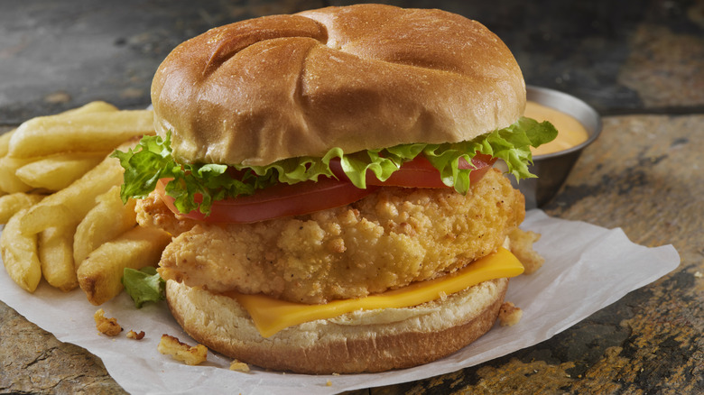 Fried chicken fast food sandwich and fries