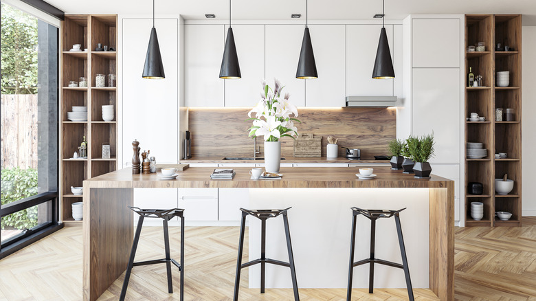 A kitchen with herringbone flooring.