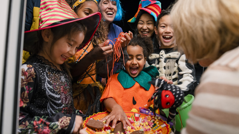 Trick-or-treaters gathered happily at door