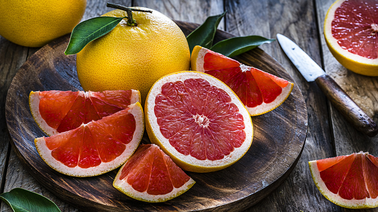 Grapefruits on wooden plate