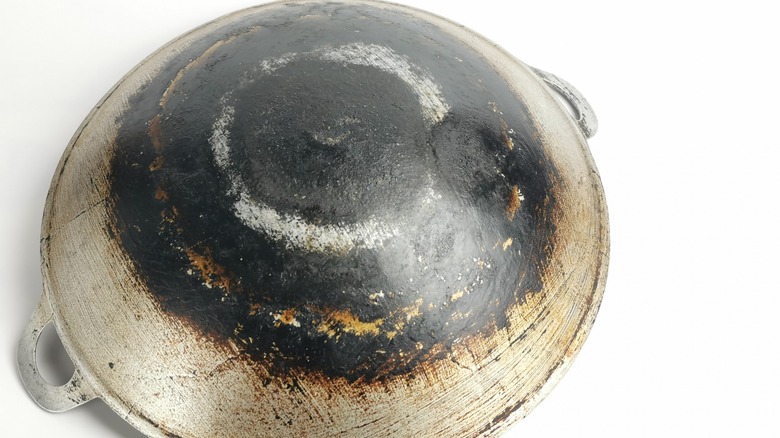 Rusted wok flipped over