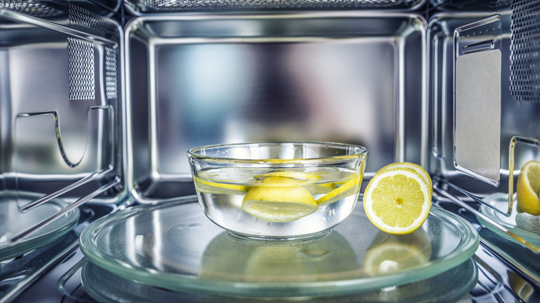 A bowl of lemon water in a microwave