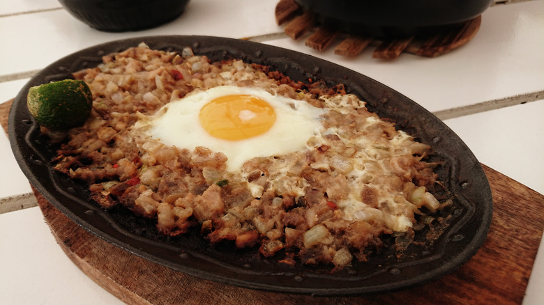 Pork jowl fried with an egg