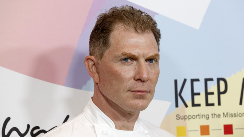 Bobby Flay in white chef's coat at Alzheimer's event