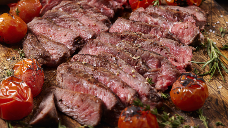 Cut steak with charred tomatoes