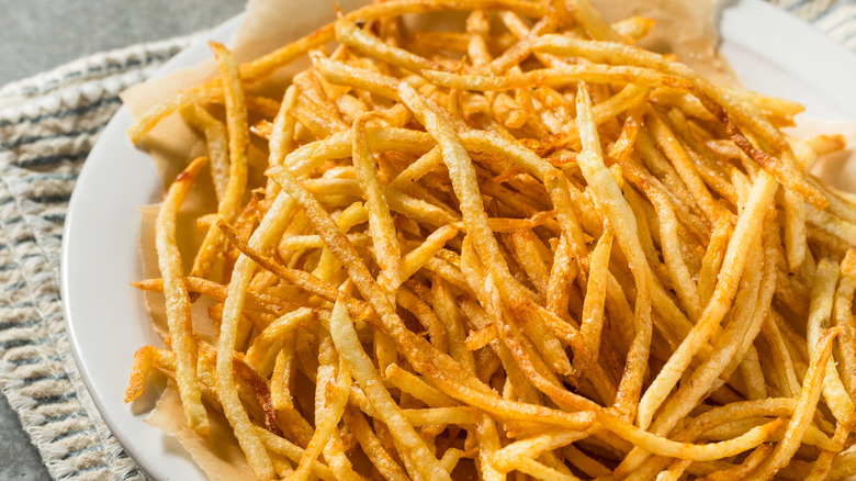 Plate of homemade shoestring french fries