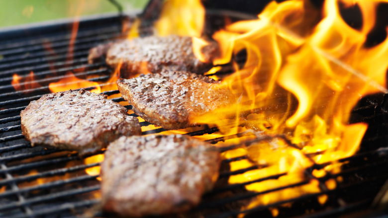 Flare-up on grill with burgers