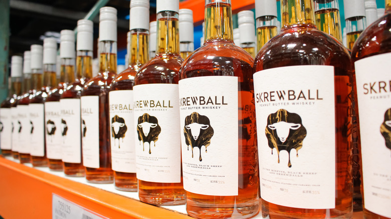 Bottles of Skrewball peanut butter whiskey in store