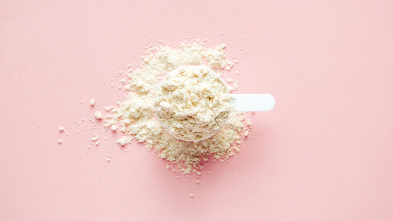 Powdered egg whites on pink background