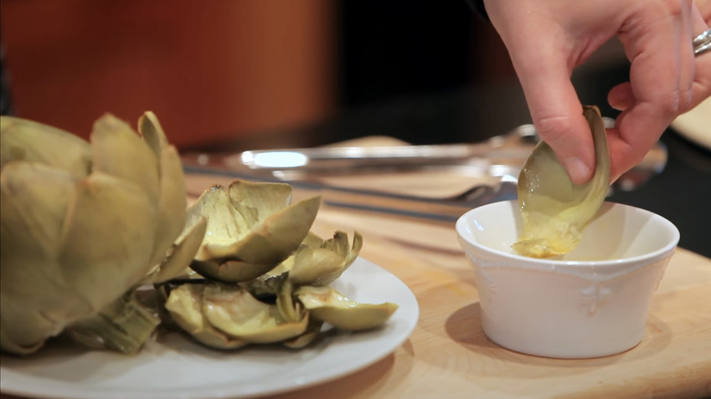 Artichoke petal dipped in sauce