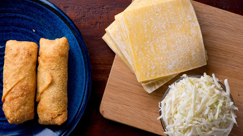 egg roll wrappers, shredded cabbage, and egg rolls