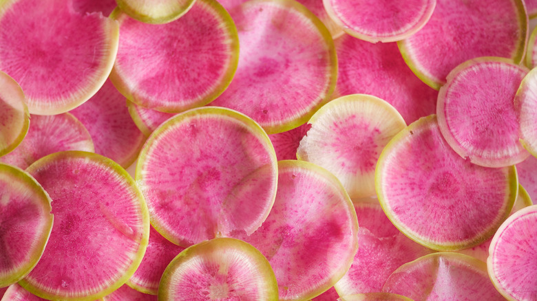 Sliced watermelon radishes layered on top of each other