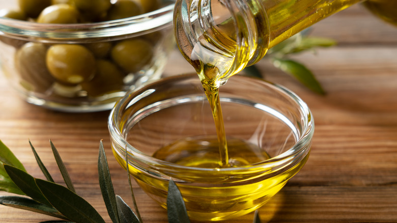 Olive oil being poured into a bowl