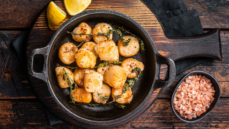 pan seared scallops in a cast iron pan