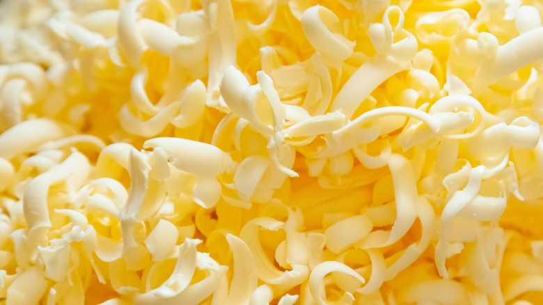 Grated butter shards sit in a pile close-up