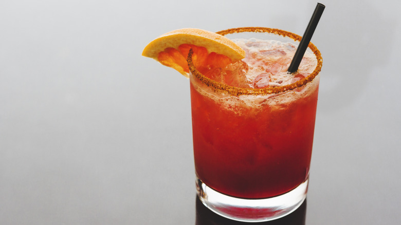 Blood orange margarita served in a glass.