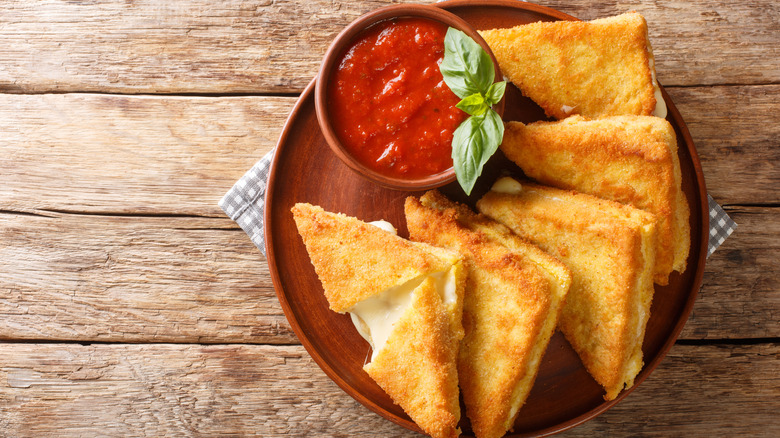 mozzarella in carrozza on a plate with a marinara sauce