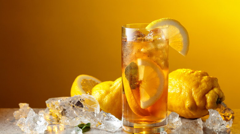 Iced tea cup pictured alongside lemon.