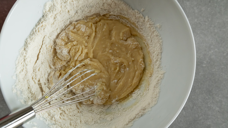 mixing lemon cookie dough in bowl