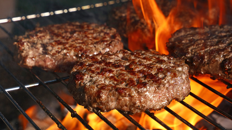 Burgers cooking on a grill