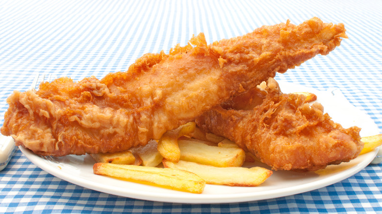 Golden brown fried fish with fries