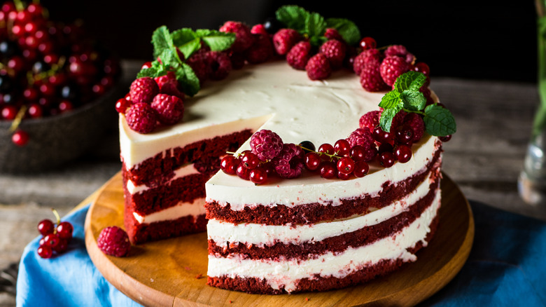 Whole red velvet cake with berries