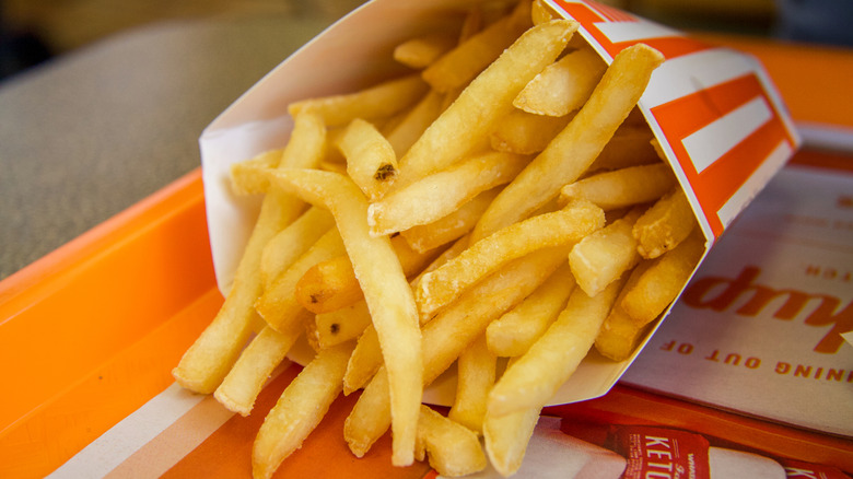 Whataburger fries spilling from their container