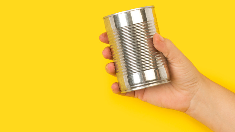 Holding can of food