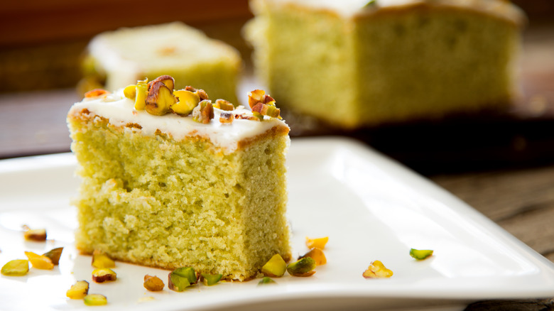 Pistachio cake on white plate