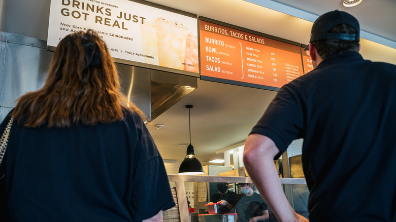 customers viewing chipotle menu