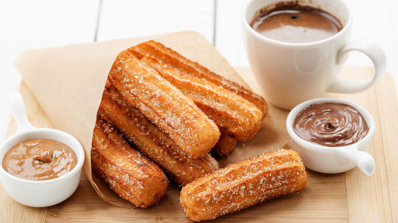 fresh churros with chocolate sauce