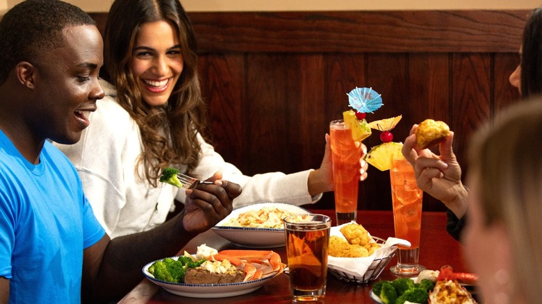 Friends smiling and laughing at Red Lobster
