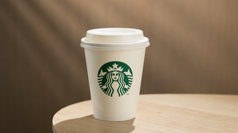 a Starbucks beverage on a table.