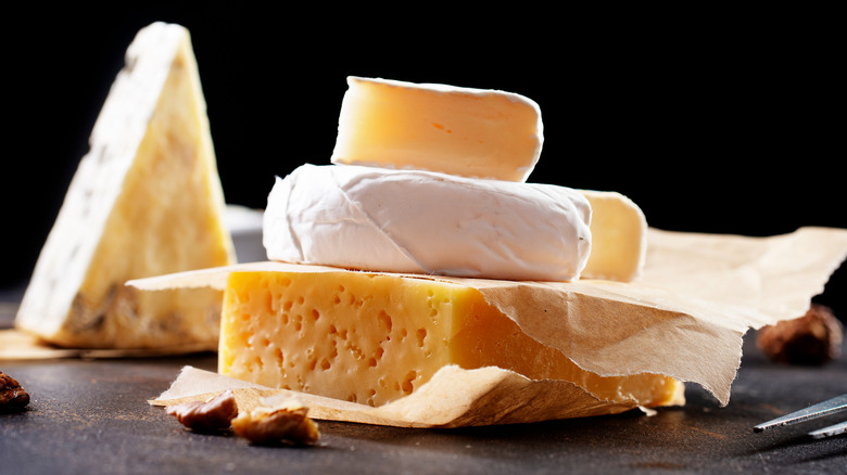different types of cheese on board